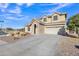 Two-story house with stone accents and a three-car garage at 11506 E Sylvan Ave, Mesa, AZ 85212