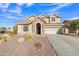 Two-story house with stone accents and a three-car garage at 11506 E Sylvan Ave, Mesa, AZ 85212