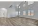 Spacious living room featuring high ceilings and vinyl plank flooring at 11506 E Sylvan Ave, Mesa, AZ 85212