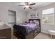 Cozy bedroom with ceiling fan and adjacent closet at 1176 E Ridgerock St, Casa Grande, AZ 85122