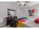 Bedroom with colorful bedding and large dresser at 1176 E Ridgerock St, Casa Grande, AZ 85122