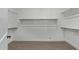 Large walk-in closet with ample shelving and hanging space at 1176 E Ridgerock St, Casa Grande, AZ 85122