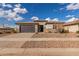 Charming single-story home with a well-manicured front yard and two-car garage at 1176 E Ridgerock St, Casa Grande, AZ 85122