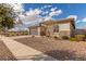 Lovely single-story home featuring a gray garage and meticulously landscaped front yard at 1176 E Ridgerock St, Casa Grande, AZ 85122