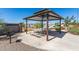 Covered picnic area with tables and benches in the community at 1176 E Ridgerock St, Casa Grande, AZ 85122