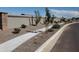 Landscaped street scene with sidewalk and decorative wall at 1176 E Ridgerock St, Casa Grande, AZ 85122