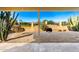 Covered patio overlooking a gravel backyard with desert plants at 11808 S Half Moon Dr, Phoenix, AZ 85044