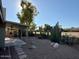 Landscaped backyard with patio cover at 11808 S Half Moon Dr, Phoenix, AZ 85044