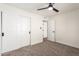 Bright bedroom with ceiling fan and closet at 11808 S Half Moon Dr, Phoenix, AZ 85044