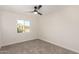 Well-lit bedroom featuring a window with backyard view at 11808 S Half Moon Dr, Phoenix, AZ 85044