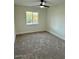 Bedroom with neutral carpet and a window at 11808 S Half Moon Dr, Phoenix, AZ 85044