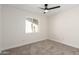 Bedroom with window and ceiling fan at 11808 S Half Moon Dr, Phoenix, AZ 85044