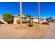 House exterior with desert landscaping and driveway at 11808 S Half Moon Dr, Phoenix, AZ 85044