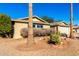 Brick ranch home with attached two-car garage and desert landscaping at 11808 S Half Moon Dr, Phoenix, AZ 85044