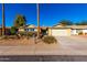 Ranch-style home with attached garage and landscaping at 11808 S Half Moon Dr, Phoenix, AZ 85044