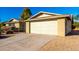 Attached two-car garage with a light-colored door at 11808 S Half Moon Dr, Phoenix, AZ 85044