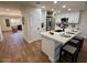 Modern kitchen with a large island and stainless steel appliances at 11808 S Half Moon Dr, Phoenix, AZ 85044