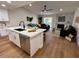 Modern kitchen with white cabinets and a large island at 11808 S Half Moon Dr, Phoenix, AZ 85044