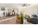 Bright living room with dining area, hardwood floors, and modern lighting at 11808 S Half Moon Dr, Phoenix, AZ 85044