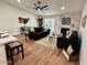 Spacious living room featuring a fireplace and wood-look floors at 11808 S Half Moon Dr, Phoenix, AZ 85044