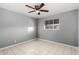 Bright bedroom with tile floors and ceiling fan at 132 W Beautiful Ln, Phoenix, AZ 85041