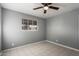 Empty bedroom with tile floors and ceiling fan at 132 W Beautiful Ln, Phoenix, AZ 85041