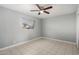 Spacious bedroom with tiled floors and neutral wall colors at 132 W Beautiful Ln, Phoenix, AZ 85041