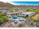 Luxury home, pool, putting green; mountain and community views at 14245 N Territory Trl, Fountain Hills, AZ 85268