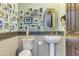 Charming bathroom with pedestal sink and gallery wall at 14245 N Territory Trl, Fountain Hills, AZ 85268