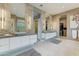 Elegant bathroom with double vanity, large mirror, and walk-in closet at 14245 N Territory Trl, Fountain Hills, AZ 85268