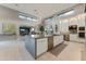 Spacious kitchen with central island, stainless steel appliances, and lots of natural light at 14245 N Territory Trl, Fountain Hills, AZ 85268