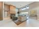 Open living space with a linear fireplace and wall-to-wall windows showcasing the backyard at 14245 N Territory Trl, Fountain Hills, AZ 85268