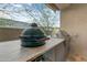 Outdoor kitchen features a Big Green Egg grill at 14245 N Territory Trl, Fountain Hills, AZ 85268