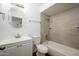 Updated bathroom with white vanity, oval mirror, and tile shower at 14626 N 36Th Pl, Phoenix, AZ 85032