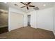 Bright bedroom with ceiling fan, double door closet and carpet at 14626 N 36Th Pl, Phoenix, AZ 85032