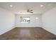 Spacious living room with tile floor and a view of the front yard at 14626 N 36Th Pl, Phoenix, AZ 85032