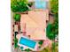 Aerial shot showcases a house with a pool, patio, beautiful landscape, and a tiled roof at 15237 S 19Th Way, Phoenix, AZ 85048