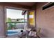 Cozy balcony with seating and beautiful views of the pool and surrounding landscape at 15237 S 19Th Way, Phoenix, AZ 85048