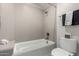 Clean bathroom with a bathtub, toilet, and a linen towel at 15237 S 19Th Way, Phoenix, AZ 85048