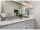 Modern bathroom featuring dual sinks, a large mirror, and stylish finishes at 15237 S 19Th Way, Phoenix, AZ 85048