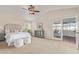 Spacious main bedroom with plush carpeting, and a sliding glass door leading to an outdoor space at 15237 S 19Th Way, Phoenix, AZ 85048