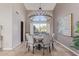 Stylish dining room featuring a chandelier, decorative painting, and window with great light at 15237 S 19Th Way, Phoenix, AZ 85048