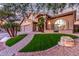 Two-story house with a brick walkway and green lawn at 15237 S 19Th Way, Phoenix, AZ 85048