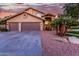 Beautiful home exterior showcasing a two-car garage, front door, and desert landscaping at 15237 S 19Th Way, Phoenix, AZ 85048