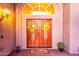 Inviting entryway with double doors, decorative wreaths, and arched window above at 15237 S 19Th Way, Phoenix, AZ 85048