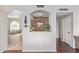 Charming hallway niche featuring stone detail, marble countertop, decor, and views into the living room at 15237 S 19Th Way, Phoenix, AZ 85048