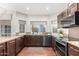 Well-equipped kitchen with granite countertops and dark wood cabinets at 15237 S 19Th Way, Phoenix, AZ 85048