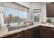 Kitchen boasts granite countertops, double sink, and ample window light at 15237 S 19Th Way, Phoenix, AZ 85048