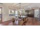 Eat-in kitchen featuring a gray concrete table with wooden base, matching bench, and modern overhead lighting at 15237 S 19Th Way, Phoenix, AZ 85048