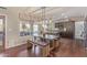Bright, modern kitchen with an island, stainless steel appliances, wooden floors, and a dining area at 15237 S 19Th Way, Phoenix, AZ 85048